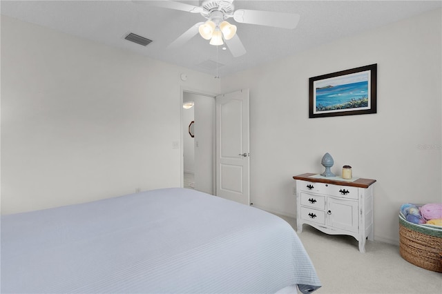 2738 Morven Park Way, The Villages, FL 32162 - bedroom with light colored carpet and ceiling fan