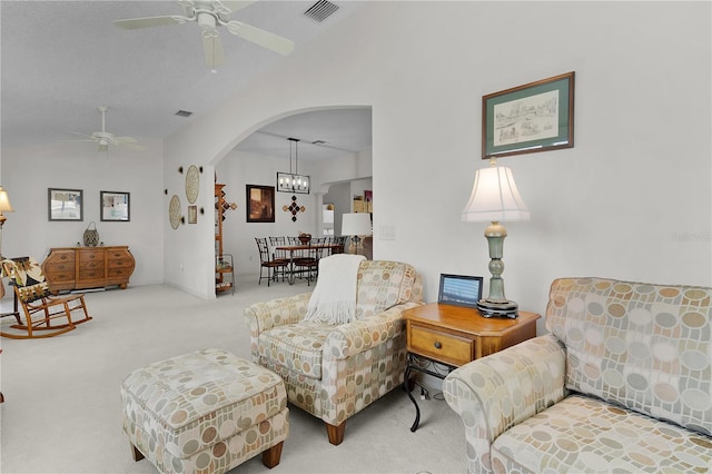 2738 Morven Park Way, The Villages, FL 32162 - carpeted living area featuring ceiling fan, vaulted ceiling, and arched walkways