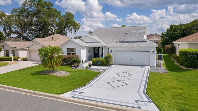 2738 Morven Park Way, The Villages, FL 32162 - view of front of property with driveway, an attached garage, roof with shingles, and a front lawn