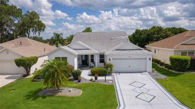 2738 Morven Park Way, The Villages, FL 32162 - view of front facade with a garage, concrete driveway, and a front lawn