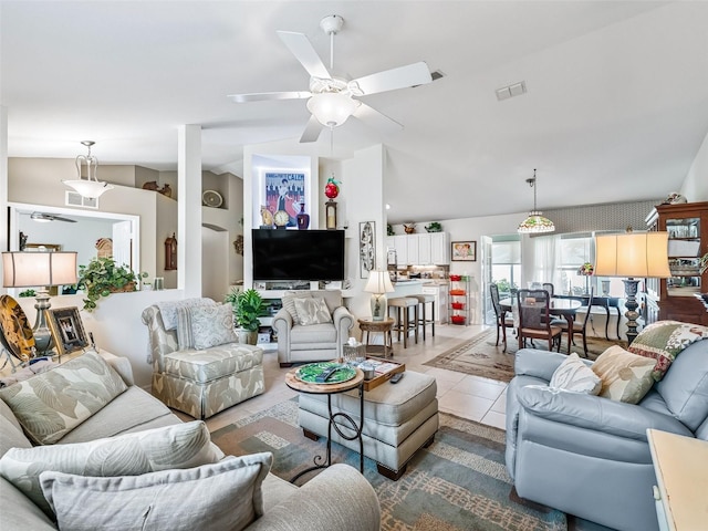 17380 SE 111th Ct, Summerfield, FL 34491 - living area featuring lofted ceiling, a ceiling fan, and tile patterned flooring