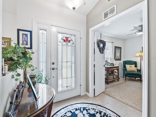 17380 SE 111th Ct, Summerfield, FL 34491 - foyer entrance featuring tile patterned floors, ceiling fan, and baseboards