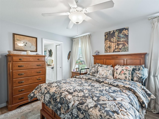 17380 SE 111th Ct, Summerfield, FL 34491 - bedroom with a ceiling fan, ensuite bath, and light wood-type flooring