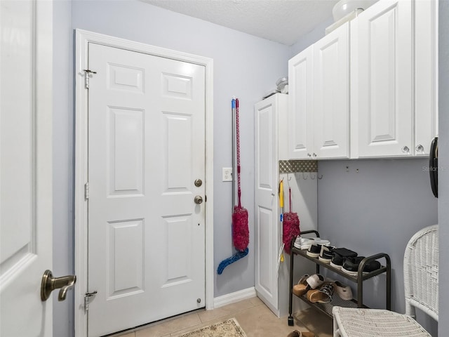 17380 SE 111th Ct, Summerfield, FL 34491 - laundry room with light tile patterned flooring