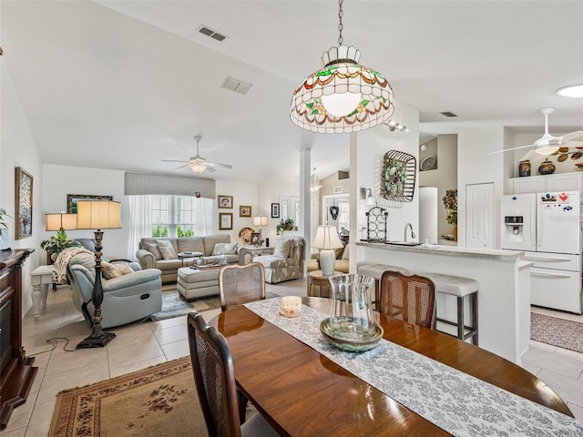 17380 SE 111th Ct, Summerfield, FL 34491 - dining space with a ceiling fan, light tile patterned floors, and high vaulted ceiling