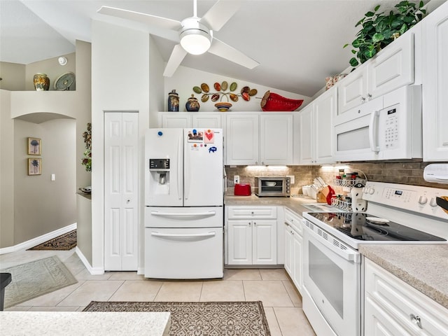 17380 SE 111th Ct, Summerfield, FL 34491 - kitchen with white appliances, backsplash, light countertops, light tile patterned flooring, and white cabinetry