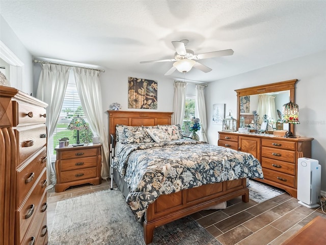 17380 SE 111th Ct, Summerfield, FL 34491 - bedroom featuring ceiling fan and a textured ceiling