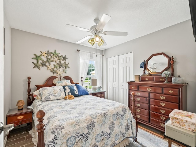 17380 SE 111th Ct, Summerfield, FL 34491 - bedroom with a closet, wood finished floors, a ceiling fan, and a textured ceiling