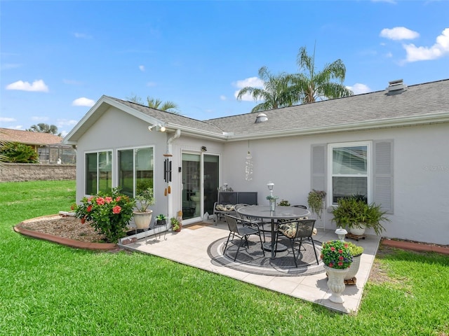 17380 SE 111th Ct, Summerfield, FL 34491 - rear view of house with stucco siding, a patio area, a lawn, and roof with shingles