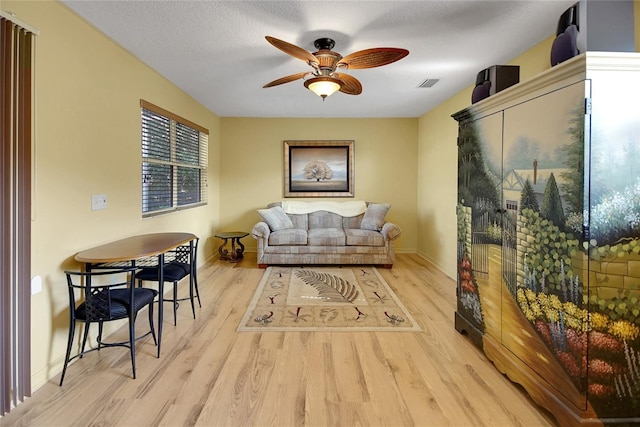 2766 Privada Dr, The Villages, FL 32162 - living area with a ceiling fan, wood finished floors, and baseboards