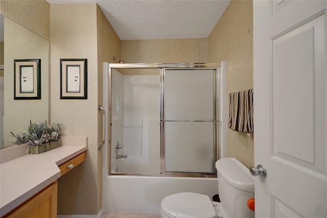 2766 Privada Dr, The Villages, FL 32162 - bathroom featuring toilet, vanity, a textured ceiling, enclosed tub / shower combo, and wallpapered walls