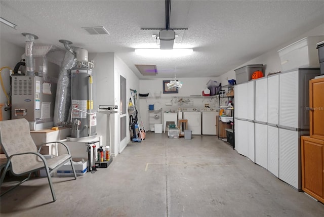 2766 Privada Dr, The Villages, FL 32162 - garage featuring water heater, washing machine and clothes dryer, and a garage door opener