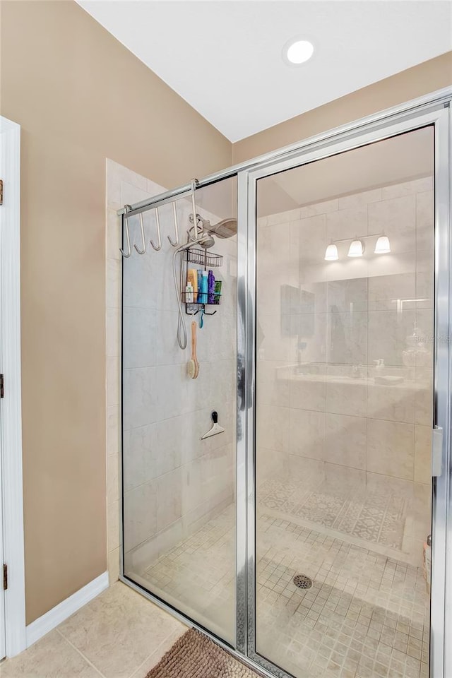 11601 Thacker Dr, Clermont, FL 34711 - bathroom with a shower stall and tile patterned floors