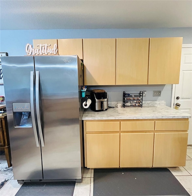 5051 NW 61st Ct, Ocala, FL 34482 - kitchen featuring stainless steel fridge with ice dispenser, light brown cabinetry, light countertops, and light tile patterned floors