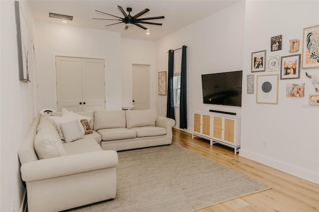 18142 Powerline Rd, Dade City, FL 33523 - living area with wood finished floors, ceiling fan, recessed lighting, and baseboards