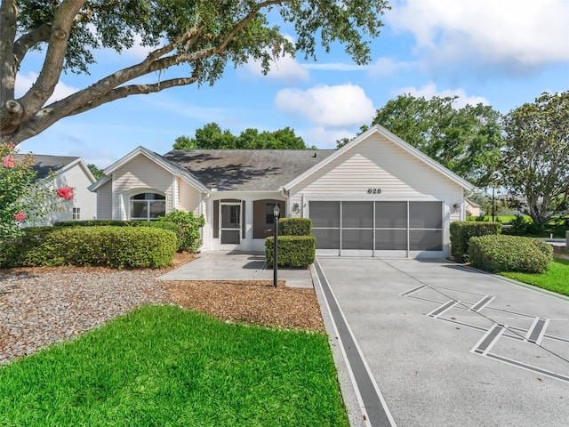628 San Pedro Dr, The Villages, FL 32159 - ranch-style home featuring a garage and concrete driveway