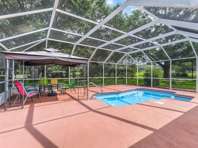 628 San Pedro Dr, The Villages, FL 32159 - swimming pool with a gazebo, a patio, and glass enclosure