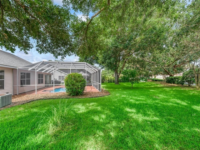 628 San Pedro Dr, The Villages, FL 32159 - view of grassy yard featuring an outdoor pool and glass enclosure