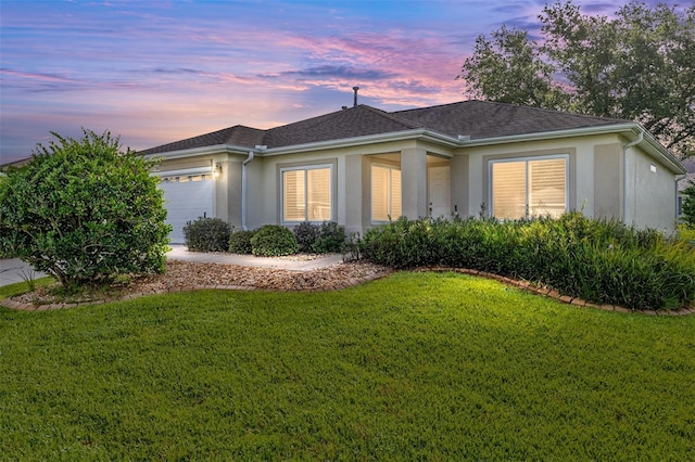 13643 SE 89th Ct, Summerfield, FL 34491 - single story home featuring stucco siding, an attached garage, a lawn, and roof with shingles