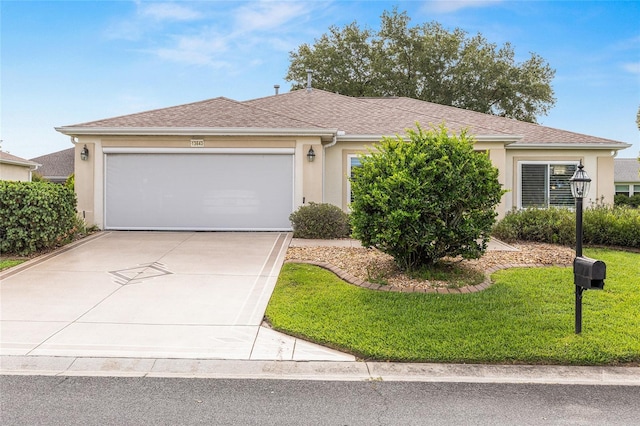 13643 SE 89th Ct, Summerfield, FL 34491 - ranch-style house with stucco siding, an attached garage, concrete driveway, and a front yard