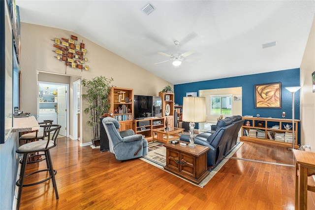 13643 SE 89th Ct, Summerfield, FL 34491 - living area with lofted ceiling, wood finished floors, and a ceiling fan