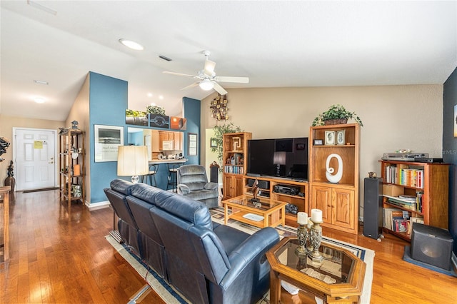 13643 SE 89th Ct, Summerfield, FL 34491 - living area with vaulted ceiling, a ceiling fan, and wood finished floors