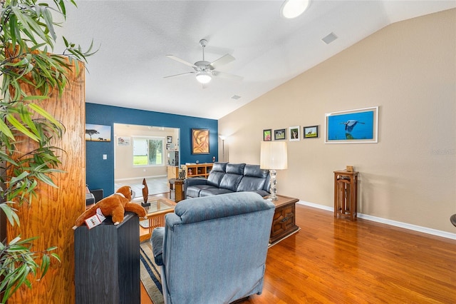 13643 SE 89th Ct, Summerfield, FL 34491 - living area with vaulted ceiling, a ceiling fan, wood finished floors, and baseboards