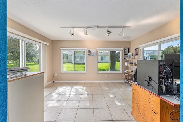 13643 SE 89th Ct, Summerfield, FL 34491 - living area featuring track lighting, light tile patterned floors, and healthy amount of natural light