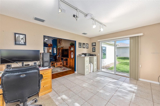 13643 SE 89th Ct, Summerfield, FL 34491 - office area with light tile patterned floors, baseboards, and rail lighting