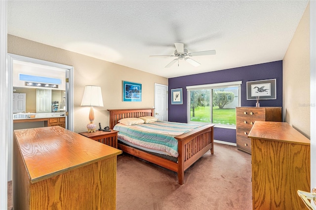 13643 SE 89th Ct, Summerfield, FL 34491 - bedroom with light colored carpet, ceiling fan, baseboards, and a textured ceiling
