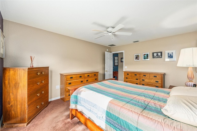 13643 SE 89th Ct, Summerfield, FL 34491 - bedroom with light carpet, baseboards, and ceiling fan