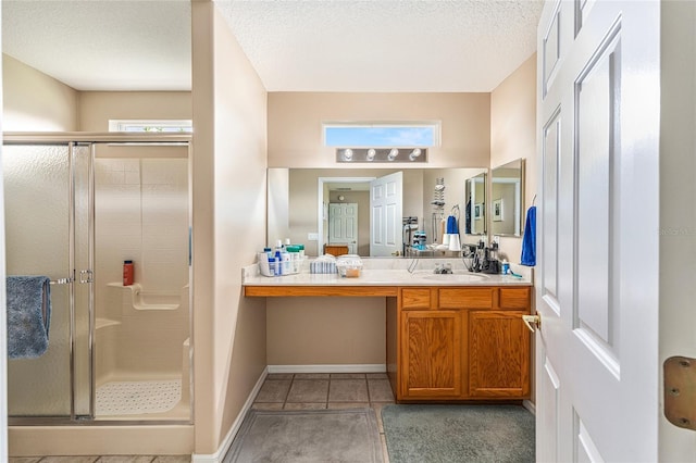 13643 SE 89th Ct, Summerfield, FL 34491 - full bathroom with a stall shower, vanity, a textured ceiling, tile patterned flooring, and baseboards