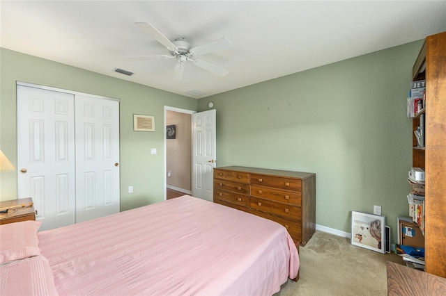 13643 SE 89th Ct, Summerfield, FL 34491 - carpeted bedroom with baseboards, a closet, and a ceiling fan