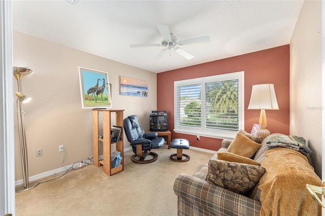 13643 SE 89th Ct, Summerfield, FL 34491 - living area with baseboards, carpet floors, and ceiling fan
