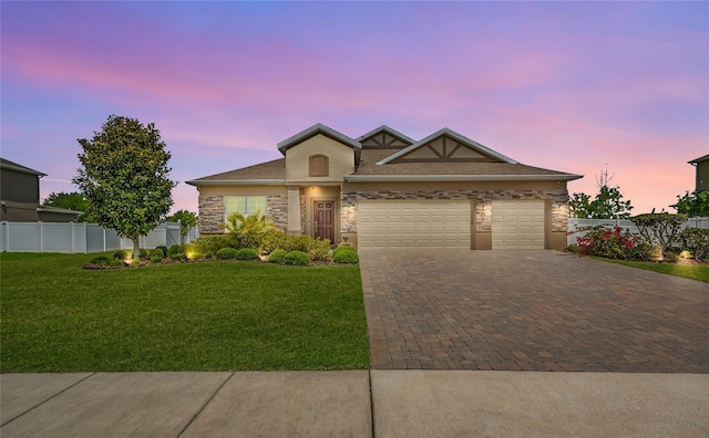 3222 San Leo Dr, Orlando, FL 32820 - view of front facade with decorative driveway, a garage, stone siding, and stucco siding