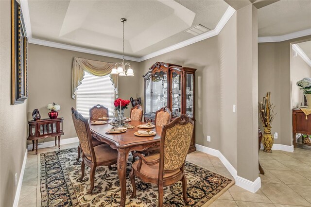 3222 San Leo Dr, Orlando, FL 32820 - dining room featuring a raised ceiling, a chandelier, light tile patterned floors, crown molding, and baseboards