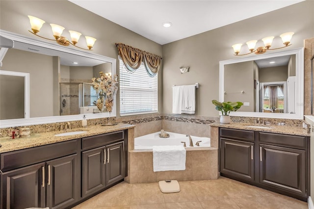 3222 San Leo Dr, Orlando, FL 32820 - full bathroom with two vanities, tile patterned flooring, a stall shower, and a garden tub