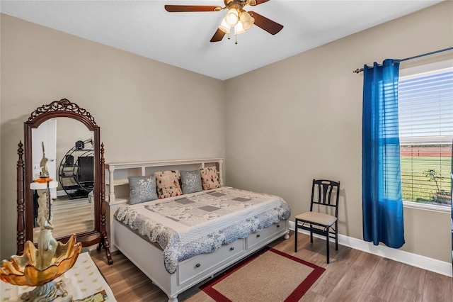 3222 San Leo Dr, Orlando, FL 32820 - bedroom with wood finished floors, baseboards, and ceiling fan