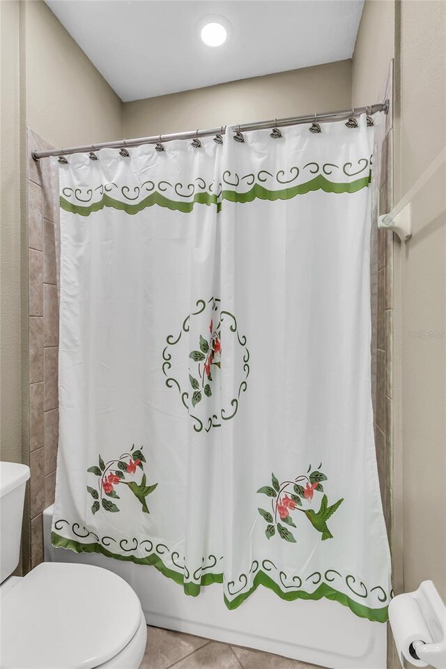 3222 San Leo Dr, Orlando, FL 32820 - bathroom with toilet, shower / bathtub combination with curtain, and tile patterned flooring