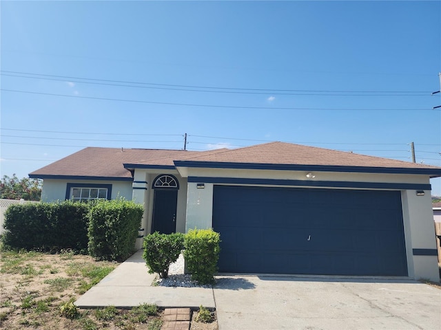 112 Arlington Ct, Haines City, FL 33844 - single story home featuring stucco siding, concrete driveway, and an attached garage