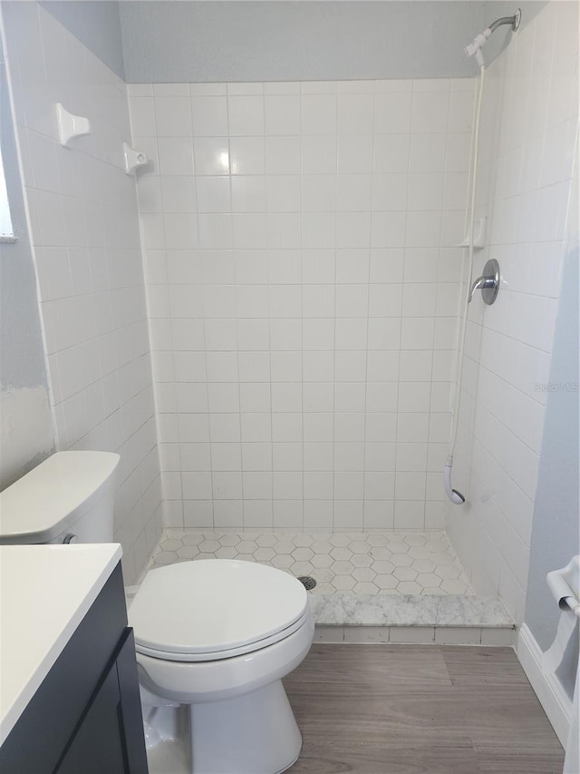 112 Arlington Ct, Haines City, FL 33844 - full bathroom with toilet, a stall shower, vanity, and wood finished floors
