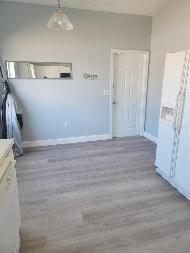 112 Arlington Ct, Haines City, FL 33844 - unfurnished dining area featuring baseboards and light wood-type flooring