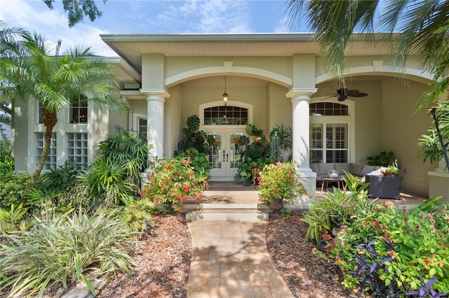 2904 Avalos Dr, The Villages, FL 32162 - entrance to property featuring french doors, stucco siding, a ceiling fan, and outdoor lounge area