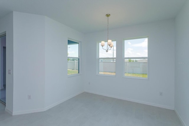 520 Silver Palm Dr, Haines City, FL 33844 - unfurnished room featuring a chandelier and baseboards