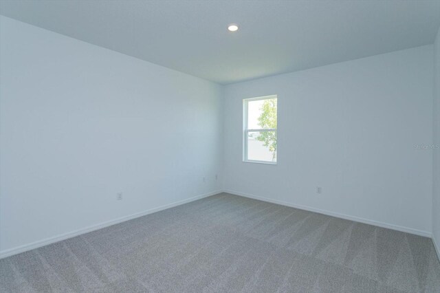 520 Silver Palm Dr, Haines City, FL 33844 - carpeted empty room featuring baseboards and recessed lighting