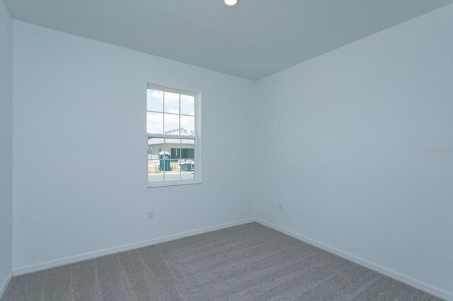 520 Silver Palm Dr, Haines City, FL 33844 - carpeted spare room featuring baseboards