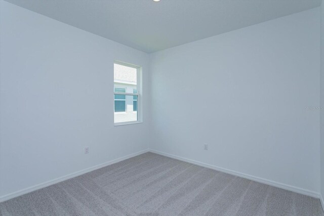 520 Silver Palm Dr, Haines City, FL 33844 - spare room featuring light colored carpet and baseboards