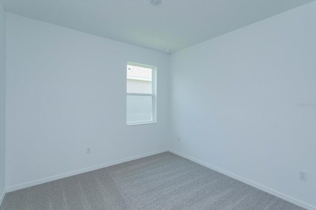 520 Silver Palm Dr, Haines City, FL 33844 - empty room with carpet flooring and baseboards