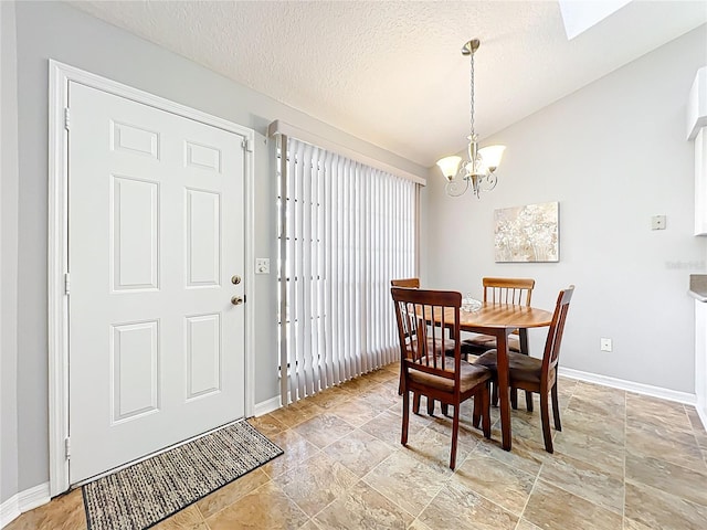 264 Juniper Way, Tavares, FL 32778 - dining room with baseboards, a chandelier, light stone finish floors, and a textured ceiling