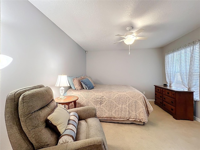 264 Juniper Way, Tavares, FL 32778 - bedroom with light carpet, a ceiling fan, a textured ceiling, and baseboards